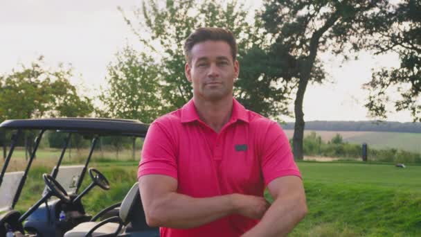 Portrait Smiling Male Golfer Standing Buggy Course Shot Slow Motion — Stockvideo