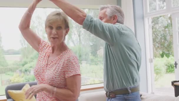 Romantic Senior Retired Couple Dancing Lounge Home Together Shot Slow — Wideo stockowe