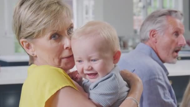 Grandmother Looking Baby Grandson Home Cuddling Comforting Him Gets Upset — Vídeo de Stock