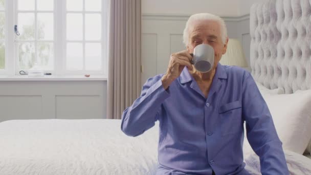 Portrait Senior Man Home Wearing Pyjamas Sitting Bed Having Morning — Wideo stockowe