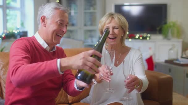 Loving Senior Couple Celebrating Champagne Christmas Tree Home Shot Slow — Stok video