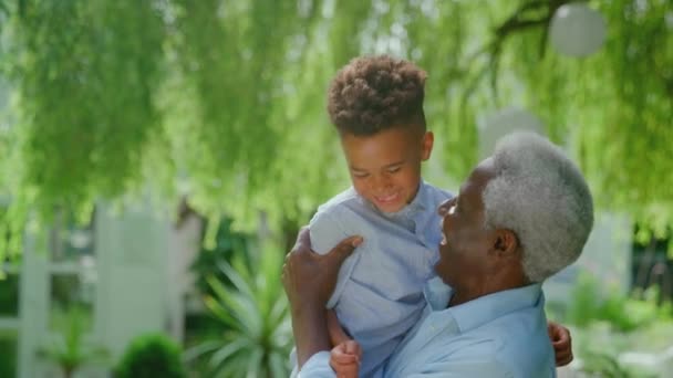 Portrait Loving Grandfather Holding Grandson Arms Hugging Talking Garden Together — Stock Video