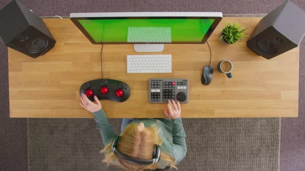 Overhead View Female Video Editor Taking Wireless Headphones Working Computer — Stockvideo