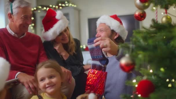 Father Unwrapping Present Socks Multi Generation Family Exchange Gifts Christmas — Stock video