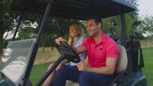 Close Couple Driving Buggy Course Playing Golf Together Shot Slow — Stock Video