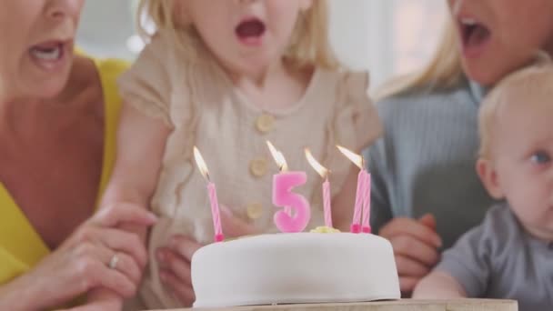 Granddaughter Blowing Out Candles Cake Mother Grandparents Birthday Party Shot — 图库视频影像