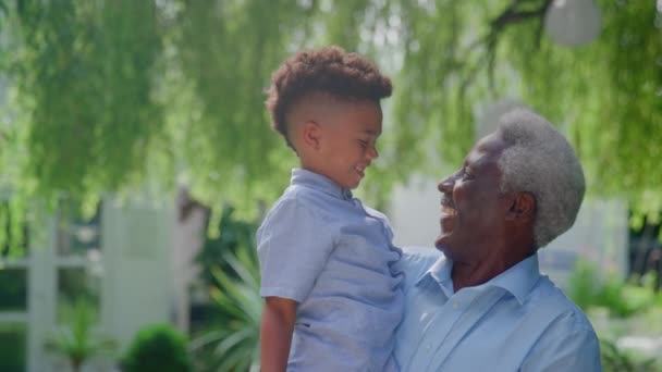 Portrait Loving Grandfather Holding Grandson Arms Hugging Talking Garden Together — Stockvideo