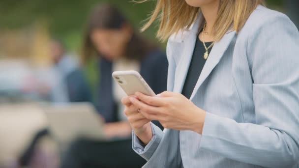 Close Female Office Workers Outdoors Use Laptop Mobile Phone Break — Vídeo de stock