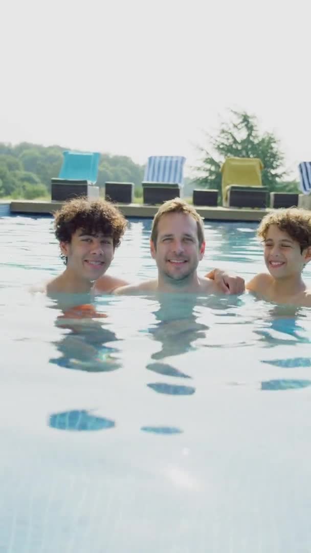 Vertical Video Father Two Sons Having Fun Outdoor Swimming Pool — Stock video