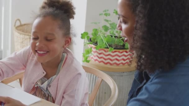 Mother Sitting Table Granddaughter Helping Her Home Schooling Using Digital — Stockvideo