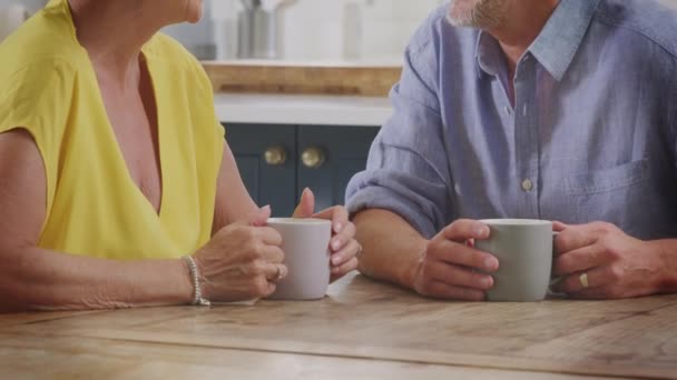 Camera Tilts Retired Senior Couple Sit Table Home Kitchen Morning — Stockvideo