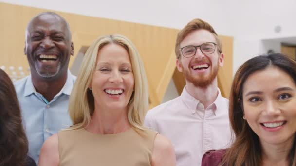 Camera Tracks Faces Smiling Multi Cultural Business Team Standing Modern — Stockvideo