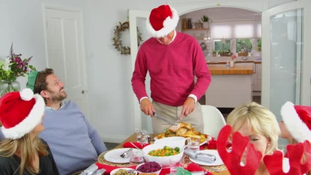 Grandfather Carving Turkey Multi Generation Family Sit Eat Christmas Meal — ストック動画