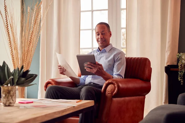 Mature Man Businessman Working Home Sits Armchair Reading Document Using — Stock Photo, Image