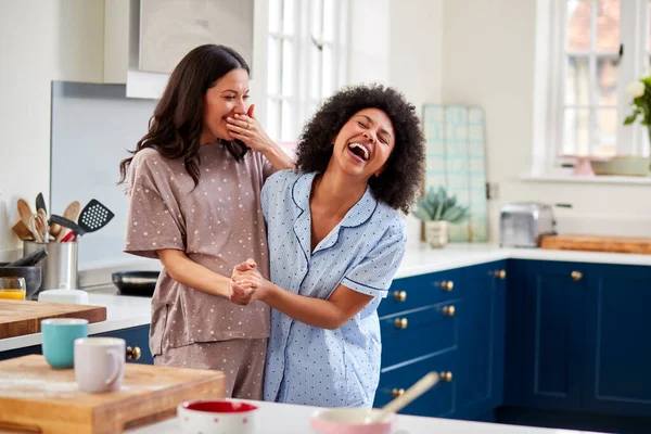 Loving Same Sex Pregnant Female Couple Wearing Pyjamas Dancing Kitchen — Stok Foto