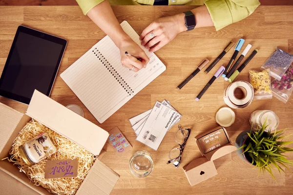 Overhead Shot Of Woman Running Online Business Making Candles At Home Writing To Do List