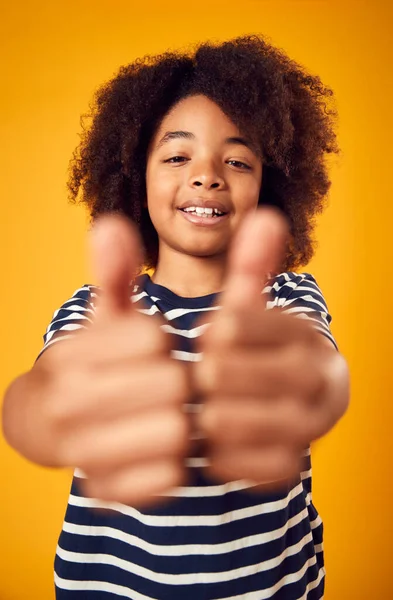 Portrait Smiling Young Boy Making Thumbs Gesture Shot Yellow Background — Stok Foto