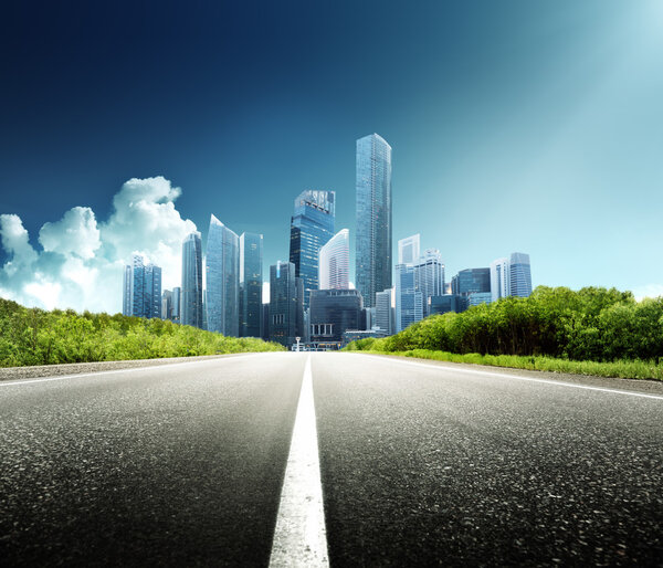 Asphalt road and modern city