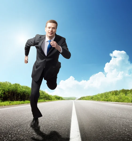 Business man run on the road — Stock Photo, Image