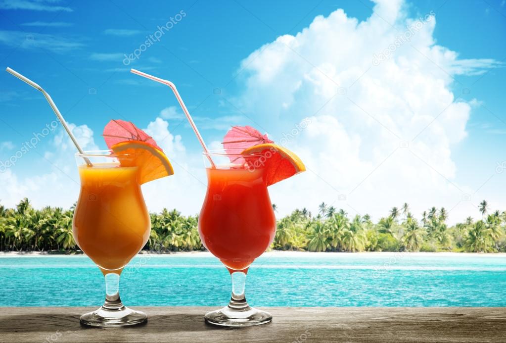 Two fresh juices on beach