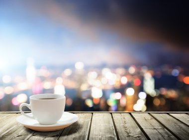coffee on table in the night city clipart