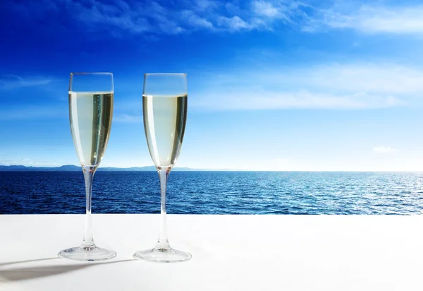 Champaign Glasses and open ocean — Stock Photo, Image
