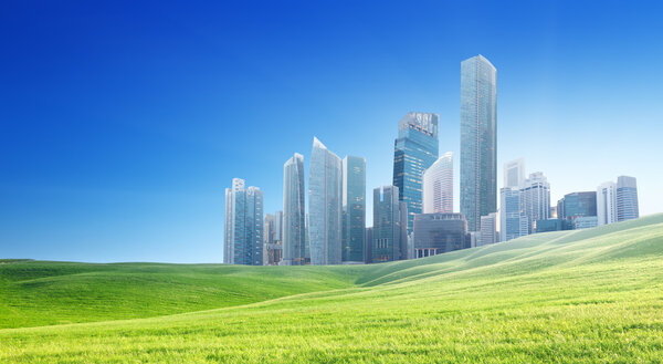 spring field and modern city