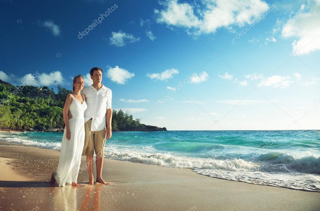 man and woman romantic couple on tropical beach 