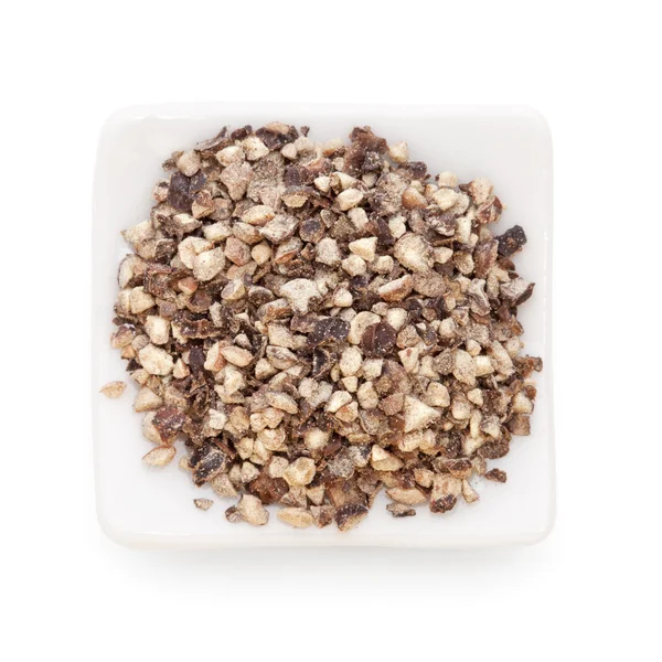 Crushed Black pepper (Piper nigrum) in a white bowl on white — Stock Photo, Image