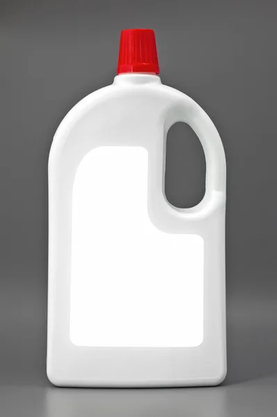 White detergent plastic bottle isolated on gray — Stock Photo, Image