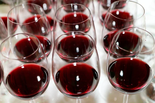 Wine glasses row over the party background — Stock Photo, Image