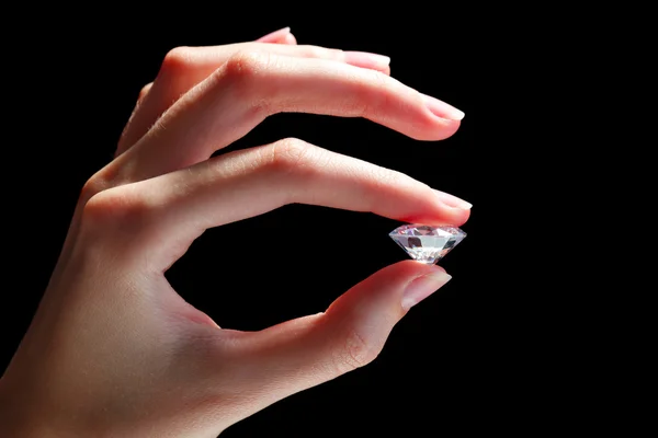 Female hand holding diamond — Stock Photo, Image