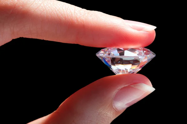 Female hand holding diamond — Stock Photo, Image