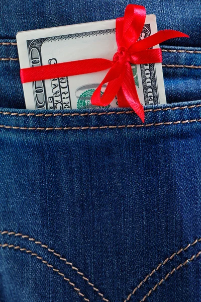 Dollar in een jeans zak — Stockfoto