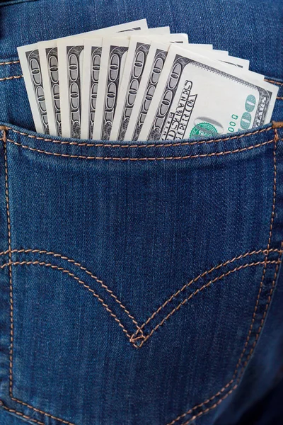 Dollar in een jeans zak — Stockfoto