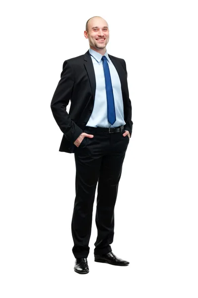 Повнометражний портрет молодого бізнесмена, що стоїть з його га — стокове фото