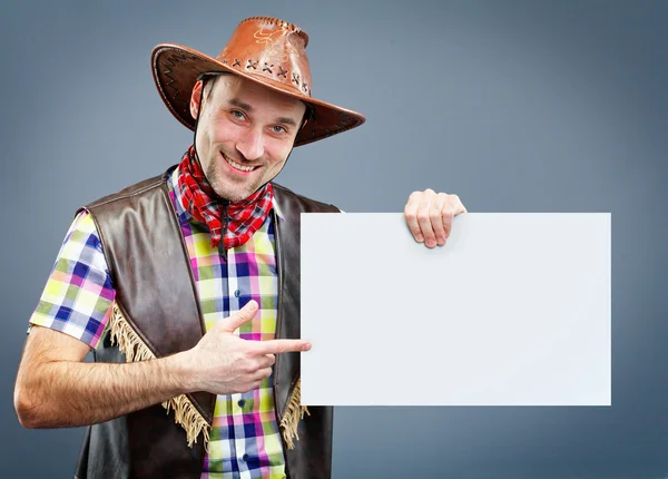 Bir afiş holding neşeli kovboy — Stok fotoğraf