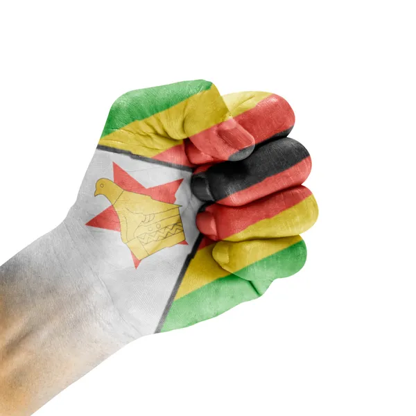 Флаг Зимбабве под рукой — стоковое фото