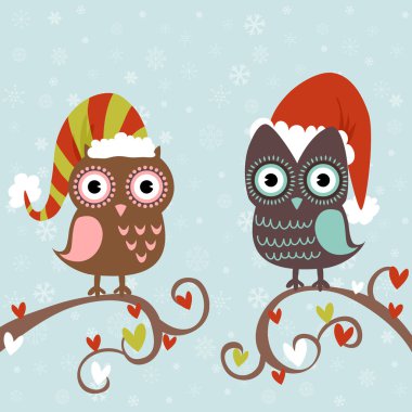 Baykuşlar bir ağaç dalı oturan şapka içinde Noel kartı