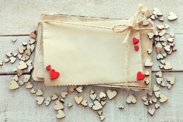 Valentine Day Background Many Small Wooden Hearts White Wooden Table — Stockfoto