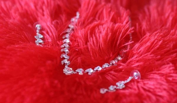 Necklace on red background — Stock Photo, Image