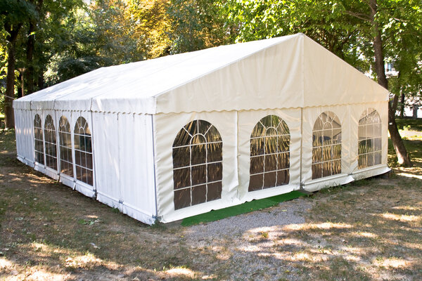 White big tent in forest