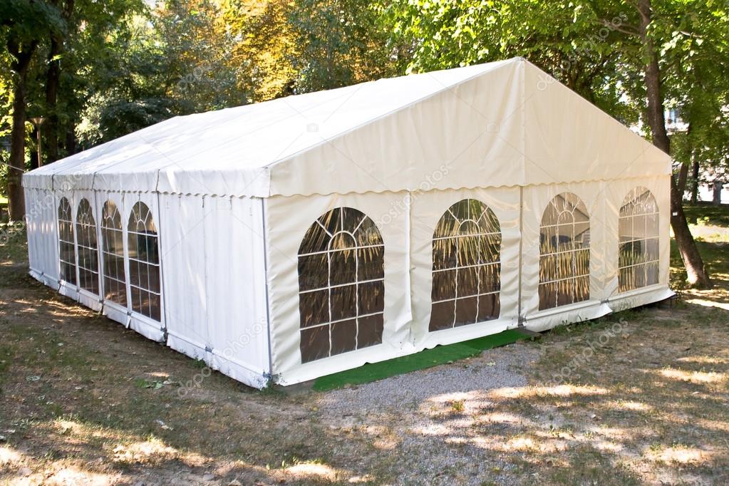 White big tent in forest