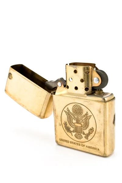 Golden lighter with carved United States seal — Stock Photo, Image