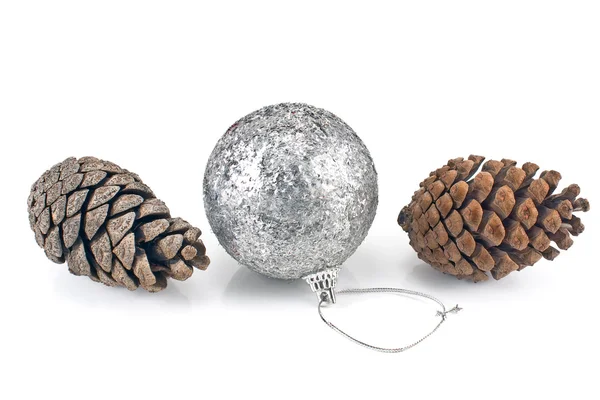 Silver christmas bauble with pine cones — Stock Photo, Image