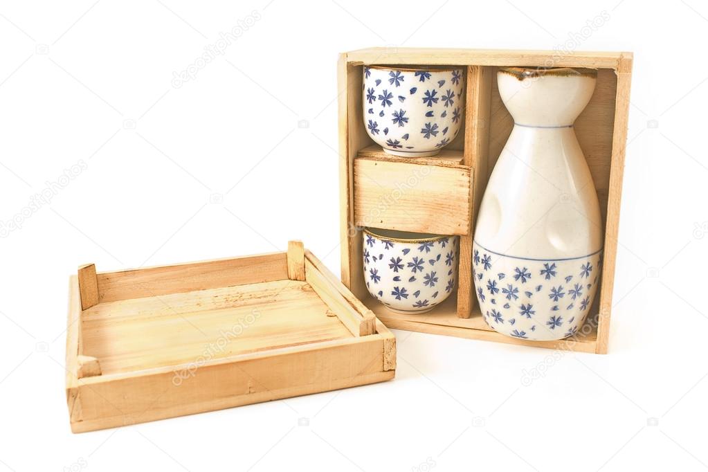 Antique porcelain vase and cups in wooden box