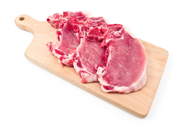 Entrecôte stek köttet på en skärbräda — Stockfoto