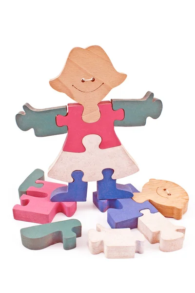 Colorful wooden girl and boy puzzle pieces — Stock Photo, Image