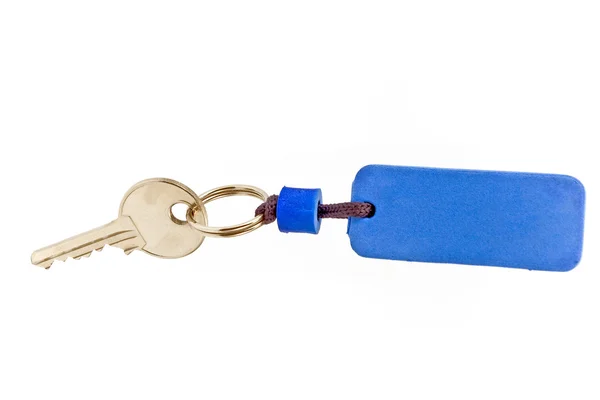Chave da casa com etiqueta azul — Fotografia de Stock