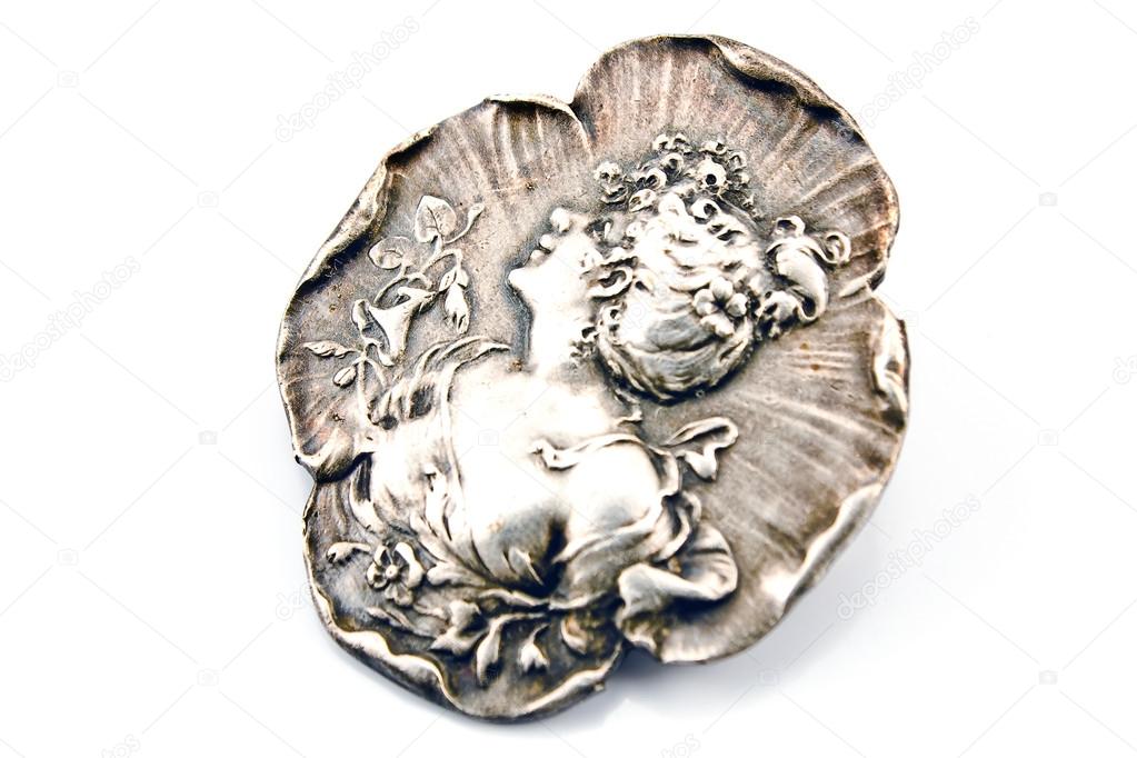 Antique silver brooch with woman's profile